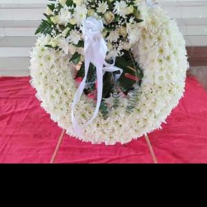 Lilies and mum funeral wreath